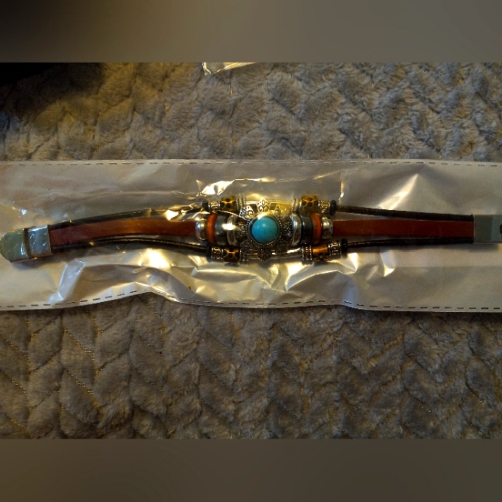 Western inspired, leather, turquoise stone.